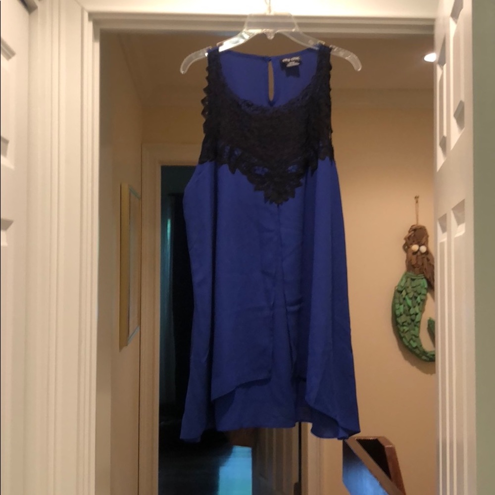 Blue sleeveless blouse with black lace detail